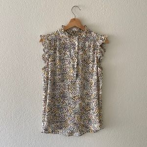 Sleeveless ruffled floral blouse, excellent condition.